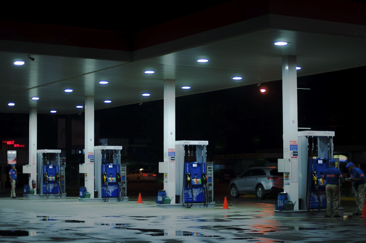 Driver refueling a car at a gas station
